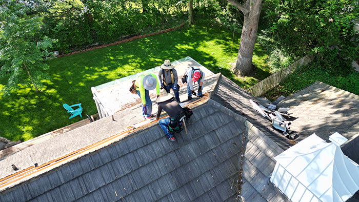 Drone view of roofers on a project.